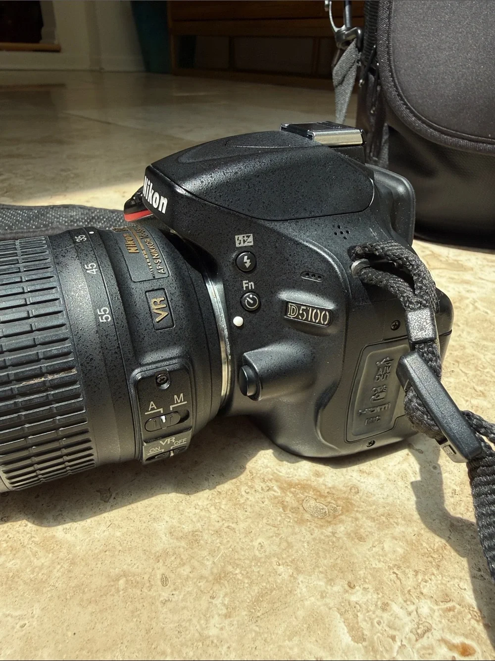 Nikon D5100 DSLR camera, 18-55mm lens, extra zoom 55-200mm, accessories, & bag